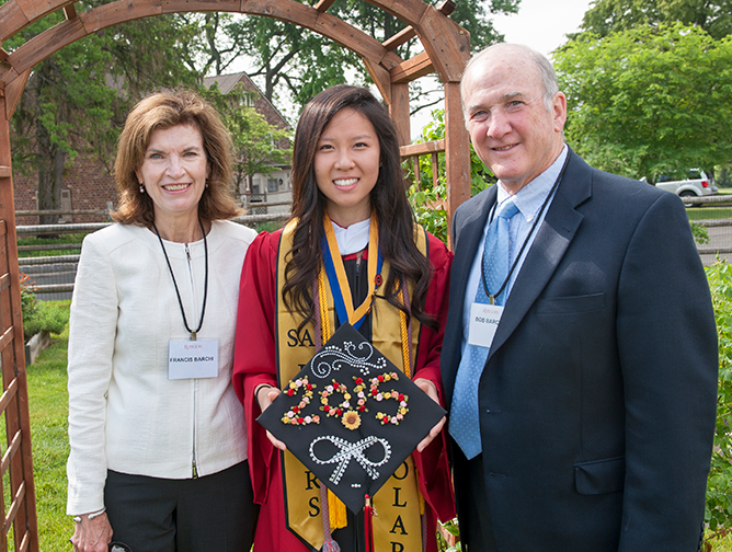 Julia Xia standing with Robert and Francis Barchi